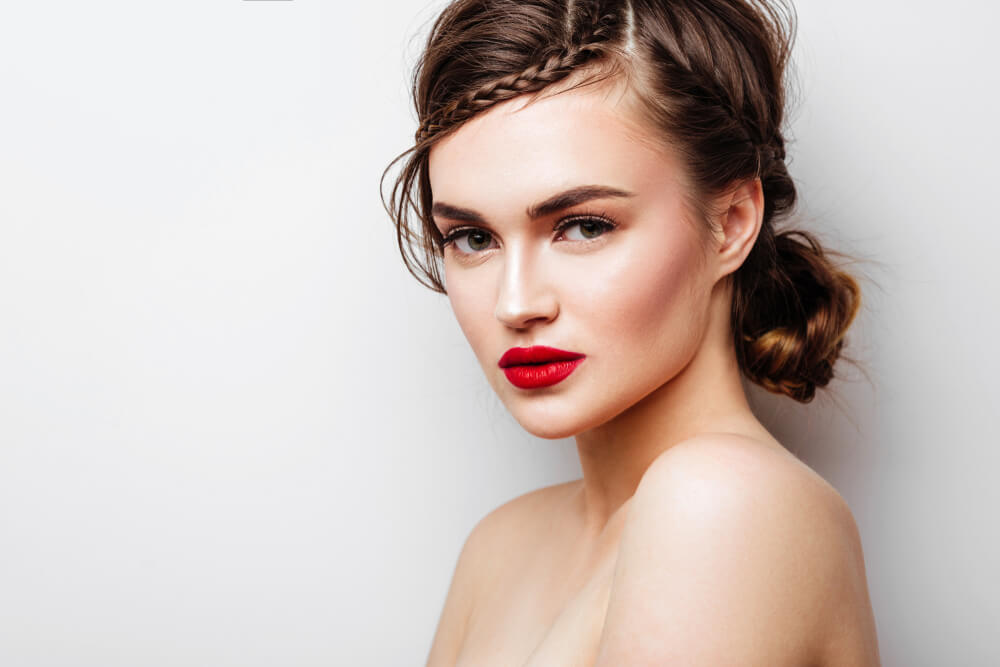 Woman showing off romantic hairstyles with braids