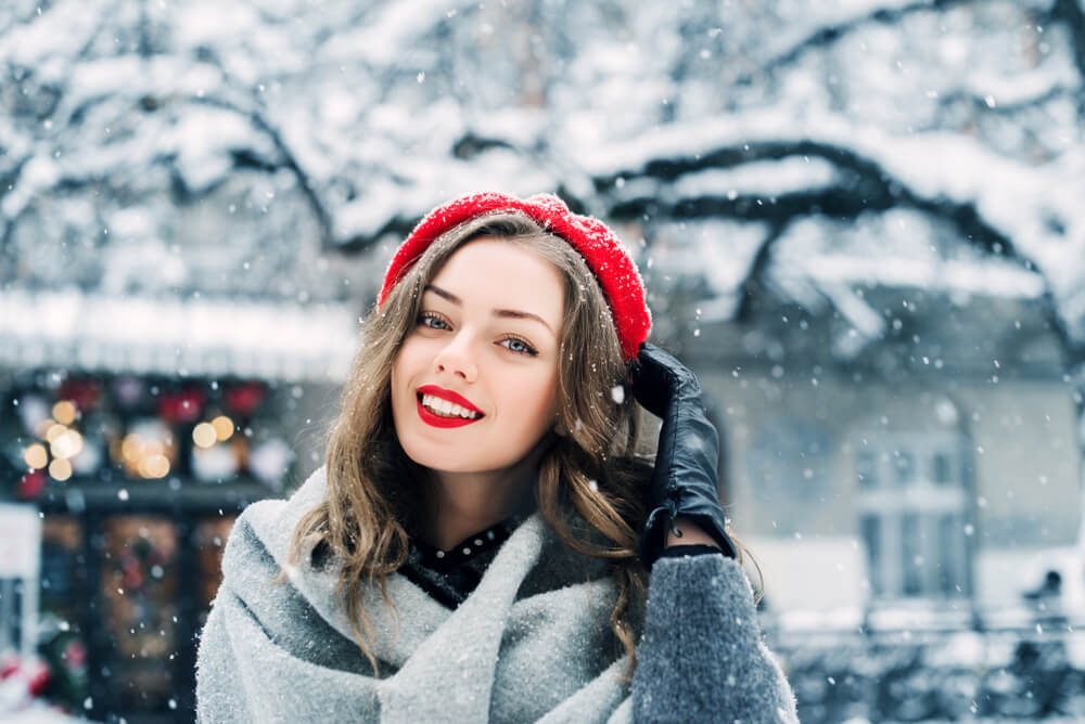 Woman with curled hair in snow