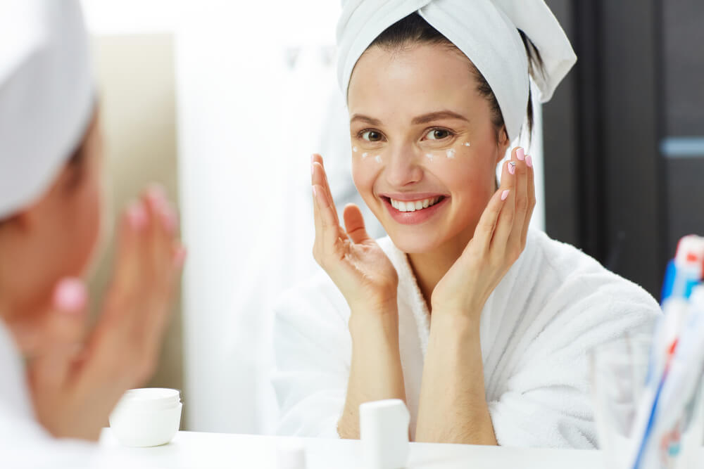 Woman applying eye cream