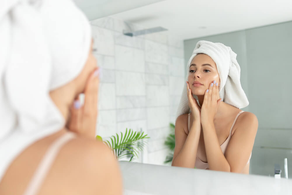 Woman applying face cream