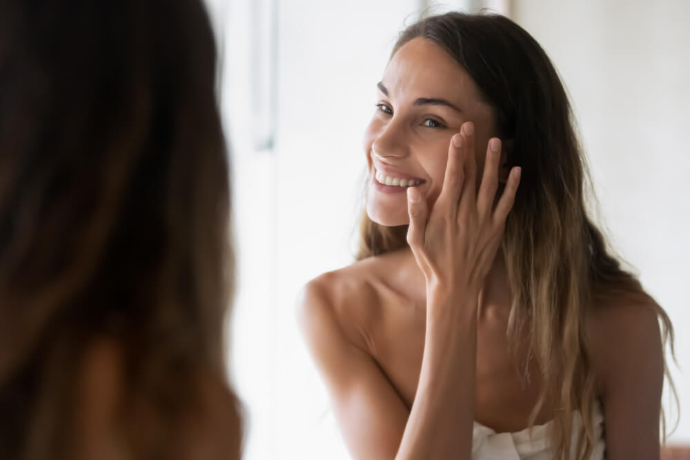 Woman applying face cream