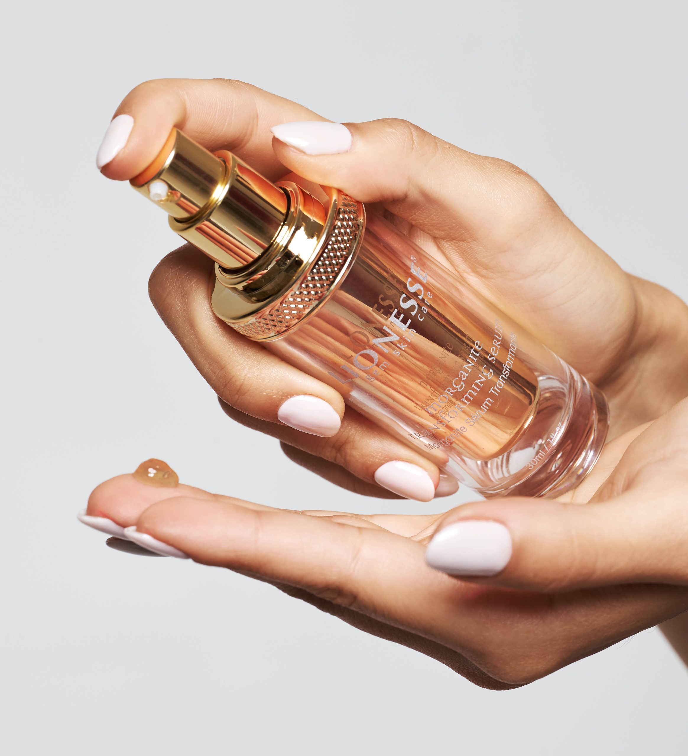 Woman using the Lionesse Morganite Transforming Serum