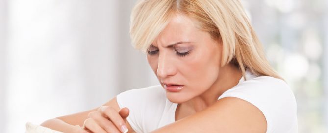Woman looking at elbow
