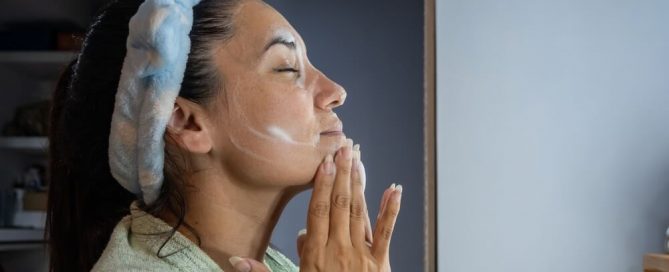 woman applying cream