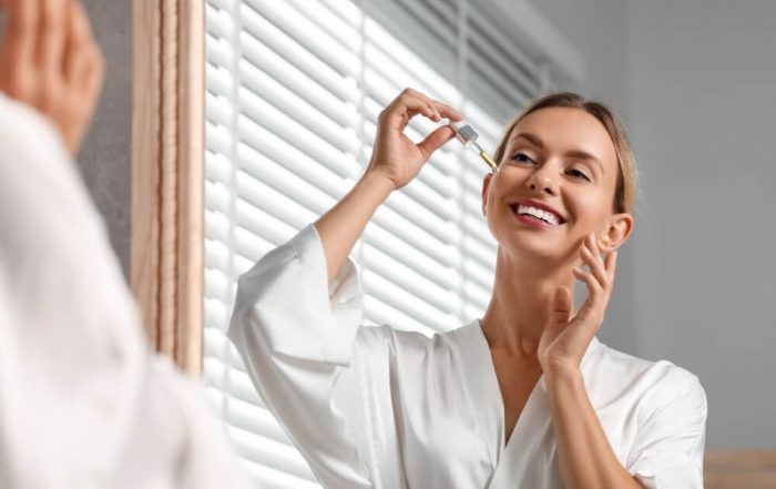 woman applying serum